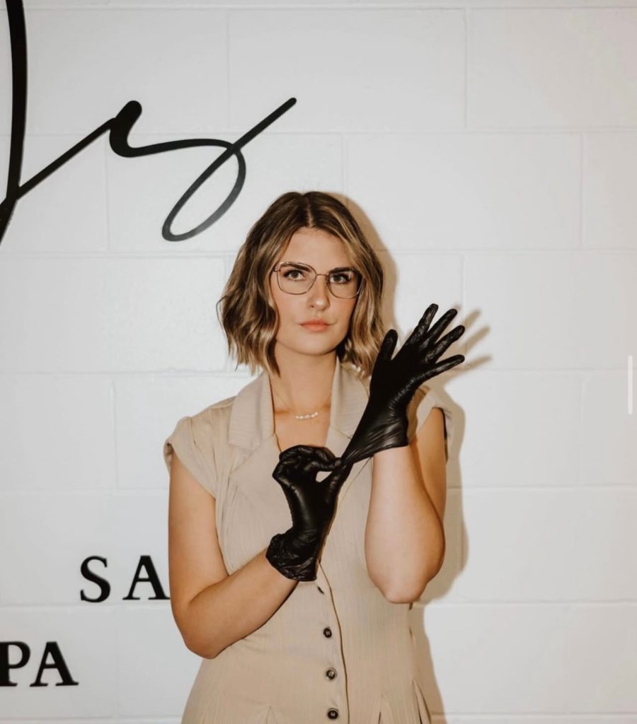 girl getting ready to give wax treatment