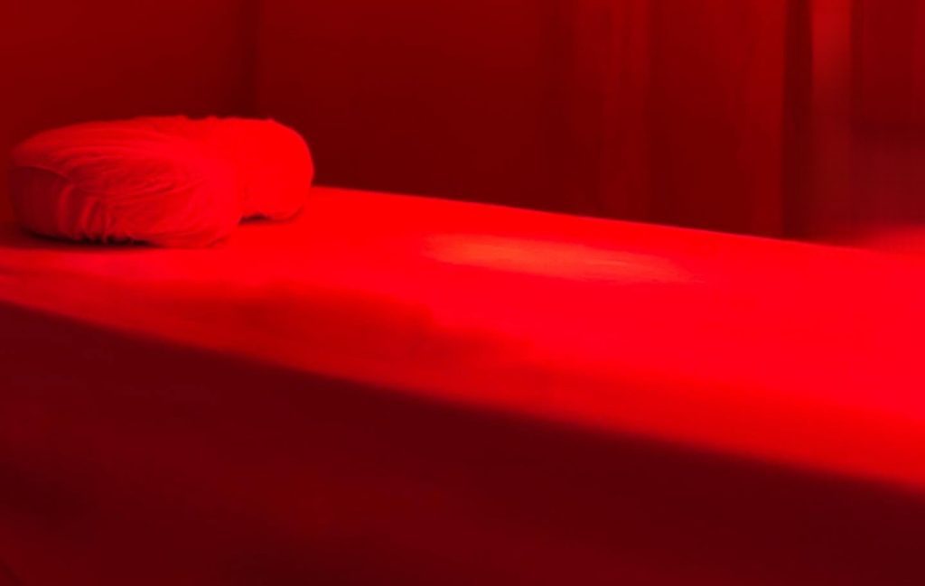 spa bed in red light therapy room